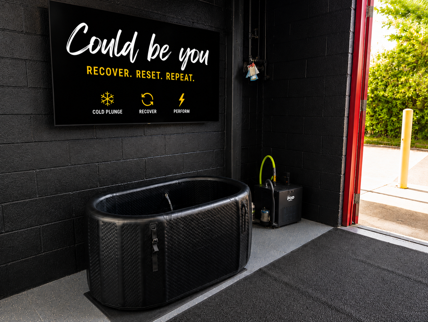 Complete cold plunge setup with tub, chiller, and signage